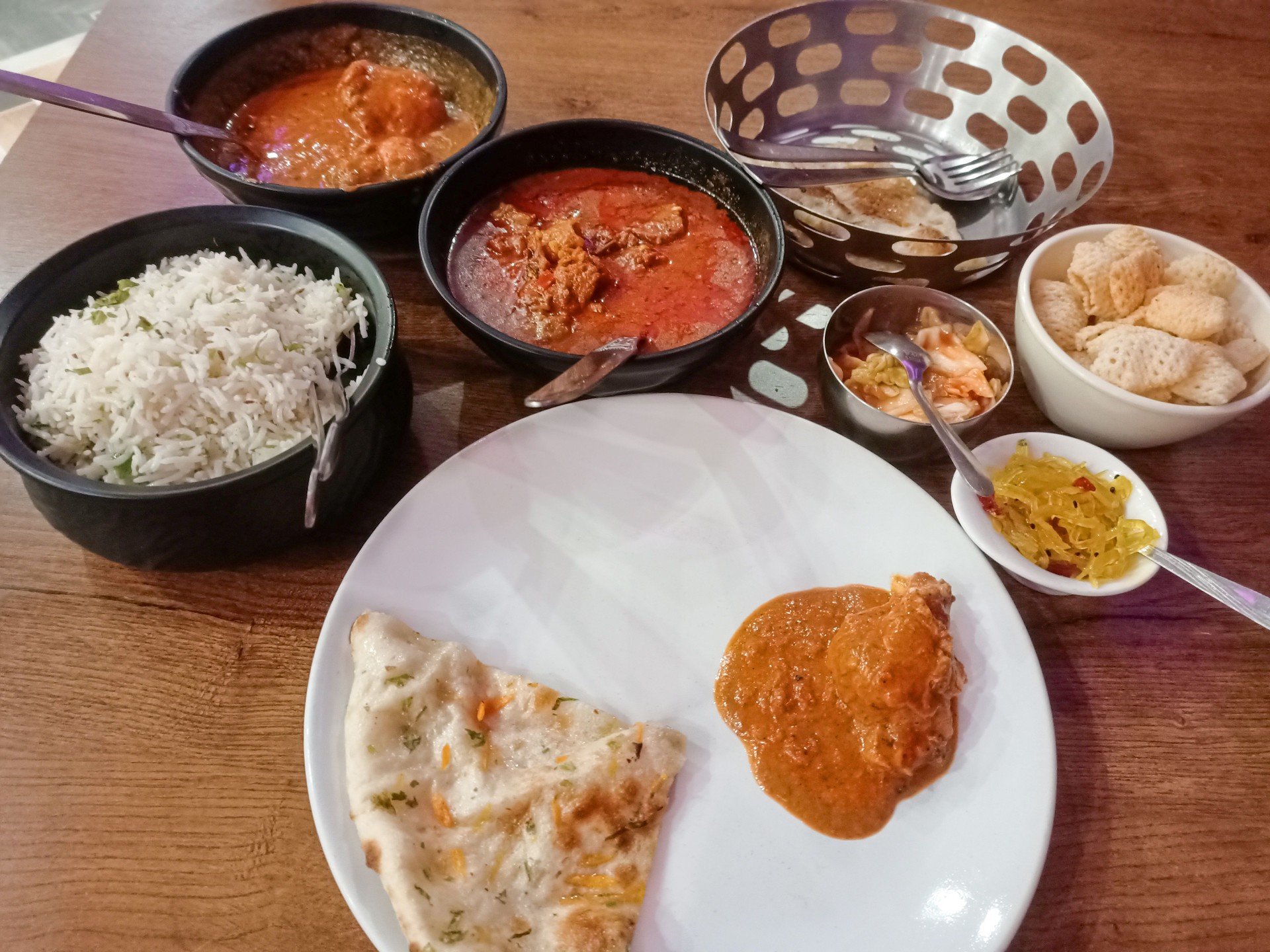 A lunch spread at an Indian restaurant, displaying various menu items